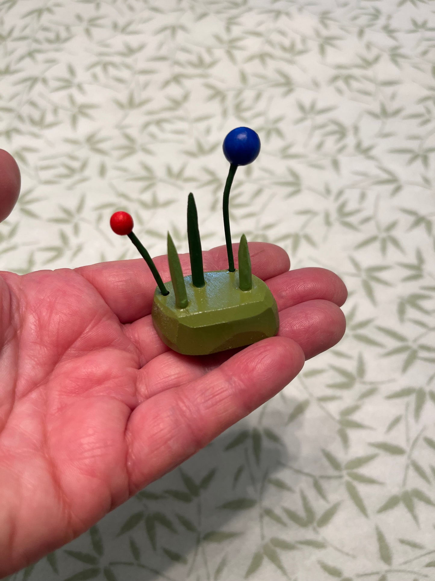 three tiny tufts of grass