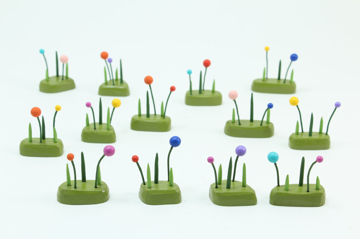 three tiny tufts of grass